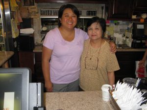 Bennie and her daughter Am behind the counter at Bennie's Thai Cafe